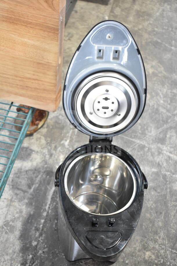 Hamilton Beach beverage holder, stainless interior, black exterior, open lid view, used condition.
