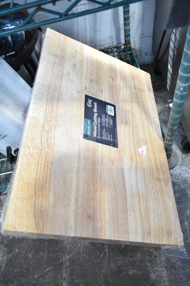 Choice 407WCB2416 wooden cutting board, 24"x16", natural finish, rectangular, label indicates brand and size, new condition.