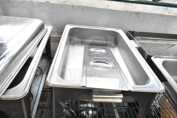 Stainless steel chafing dishes set of four. Each with lid, in good condition. Ideal for catering or events.