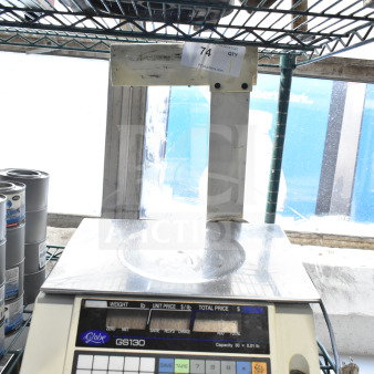 Globe GS130 commercial countertop scale, 30-pound capacity with digital display, used condition, on wire shelf.