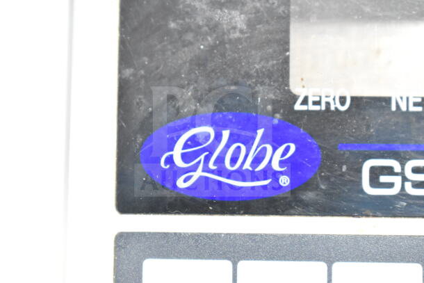 Globe GS130 commercial countertop scale, 30 lb capacity, features brand logo. Condition shows visible use.