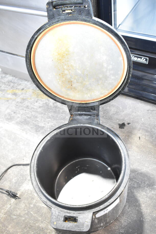Winco RW-S451 countertop electric rice warmer, open lid, 120 volts, showing interior condition with visible wear and power cord.