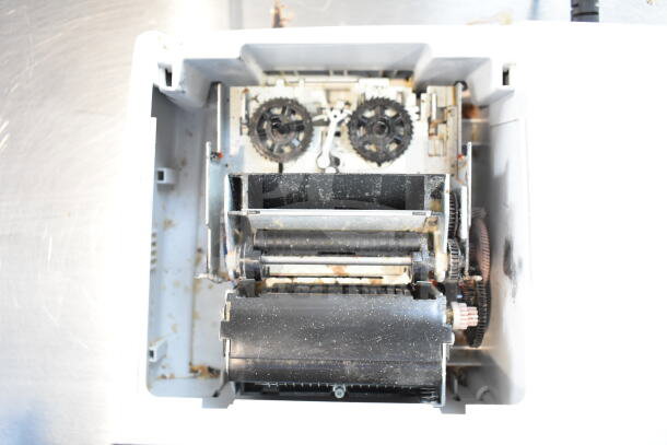Sharp EL-1197PIII printing calculator, internal view showing gears and rollers, some wear evident.