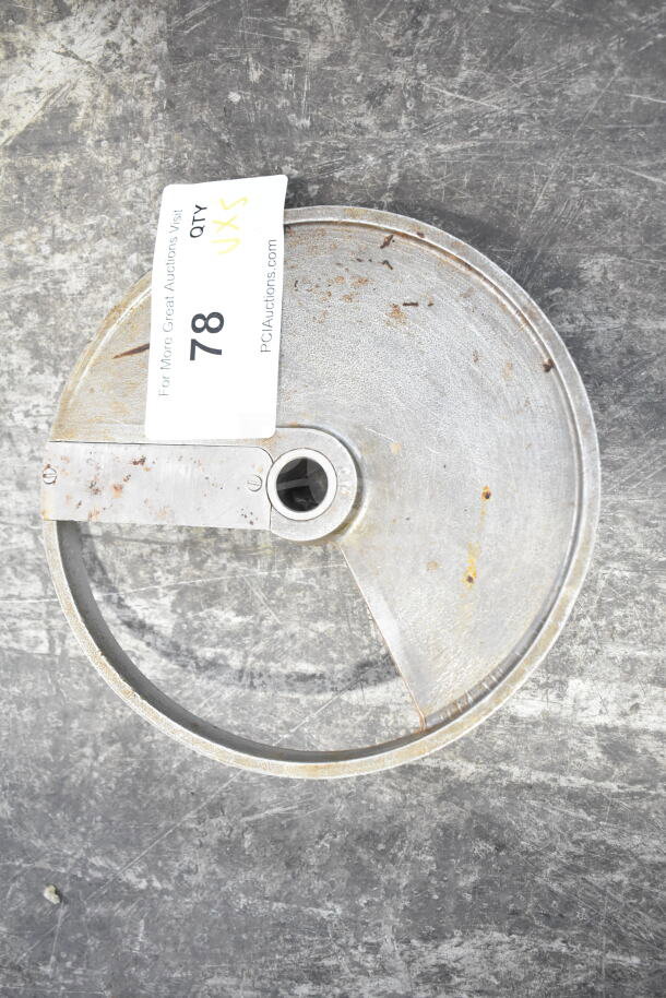 Circular metal blade with central hole, slight rust spots, marked "78 QTY 5XS" on a tag, indicating auction lot details.