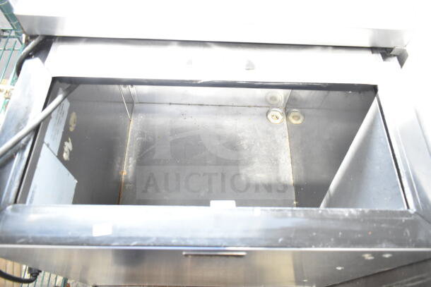 Perlick Back Bar Bottle Cooler with sliding lid, 115 volts, 1 phase. Interior shows mild wear, suitable for commercial use.