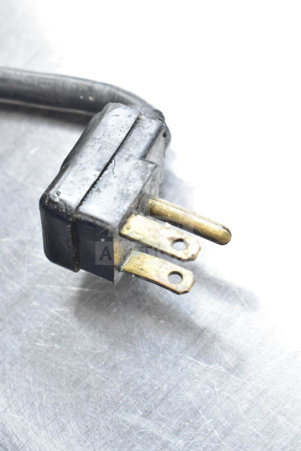 Perlick Back Bar Bottle Cooler plug, 115 volts, 1 phase, black and brass contacts, in used condition.