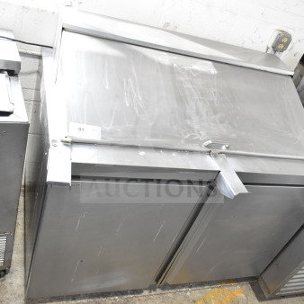 Delfield 4448NP-18M-A5 Commercial Sandwich Prep Table; stainless steel, two doors, 115V, in good condition.