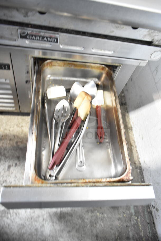 Traulsen Commercial 2 Drawer Chef Base, 115 Volts, 1 Phase. Includes utensils in drawer. Visible wear and rust.