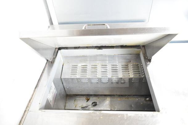 Continental SW48-12M sandwich salad prep table, stainless steel, visible wear, internal storage, 115V, 1 phase.