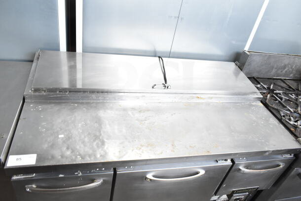 Continental CPA60 commercial pizza prep table, stainless steel, visible wear, 115 volts, 1 phase, dual doors.