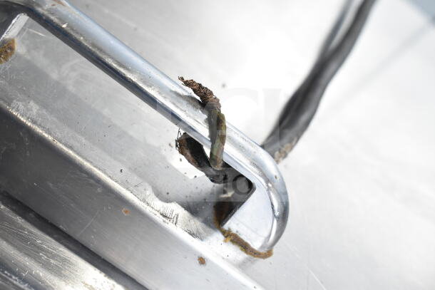 Damaged wiring and rust on the handle of Continental CPA60 Commercial Pizza Prep Table, indicative of wear.