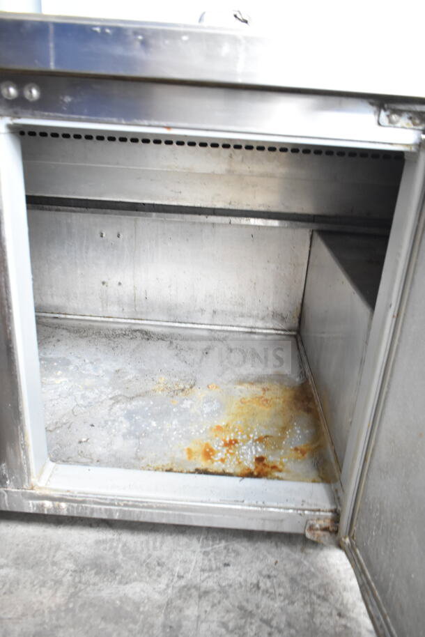 Continental CPA60 Pizza Prep Table, stainless steel interior with visible signs of wear and rust, 115V, 1 Phase.