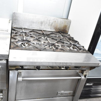 Garland commercial gas 6-burner range with convection oven. Features robust stainless steel build. Used condition.