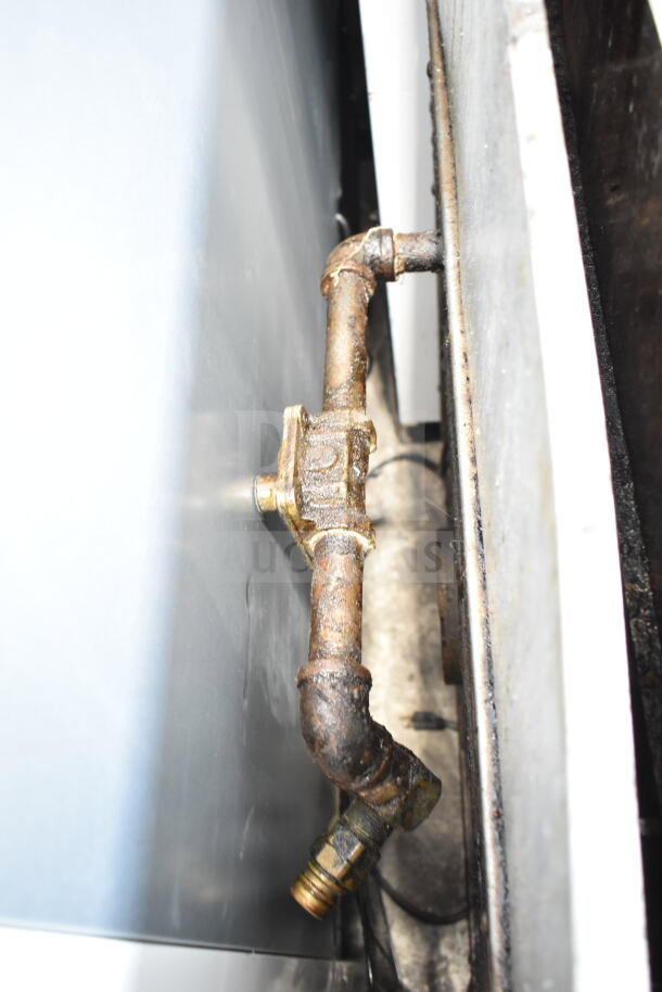 Gas pipe connection for Garland Commercial Gas Powered 6 Burner Range with Convection Oven, showing moderate wear.