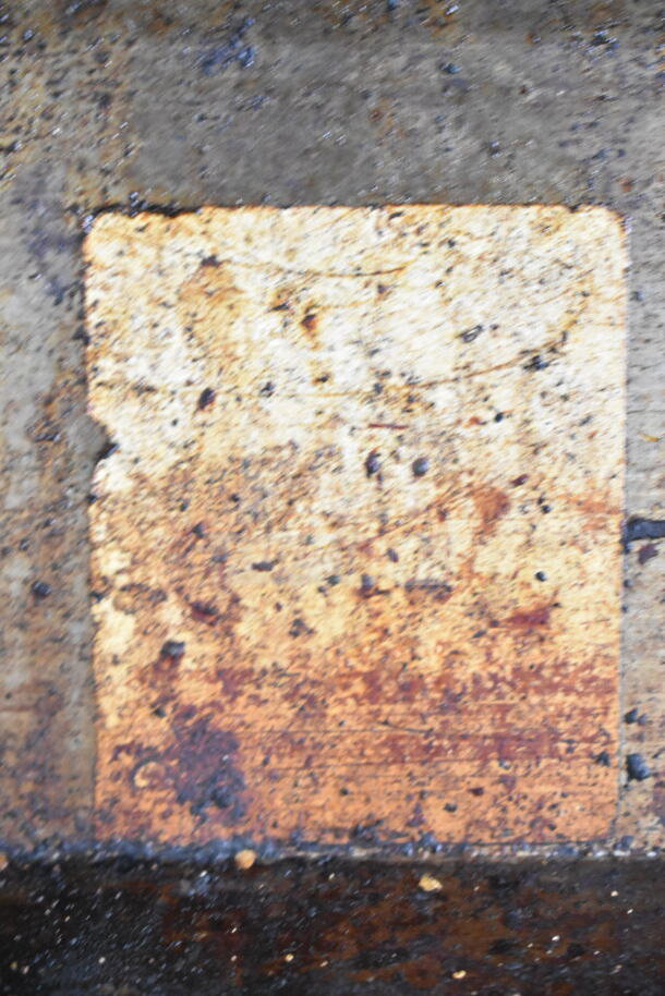 Garland commercial gas 6-burner range with convection oven, used; visible wear and rust on surface. Model details partially obscured.