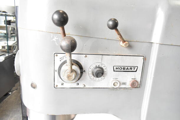 Hobart M 802 commercial 80-quart dough mixer with control panel. Includes mixing bowl, dolly, whisk, paddle, and dough hook.