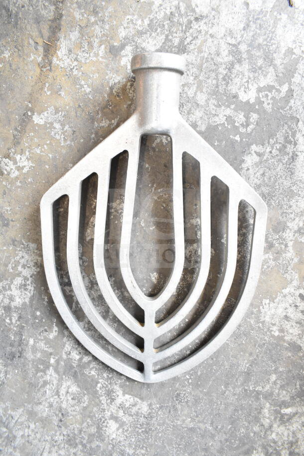 Metal paddle attachment for Hobart M 802 mixer, featuring durable construction, used in commercial baking applications.