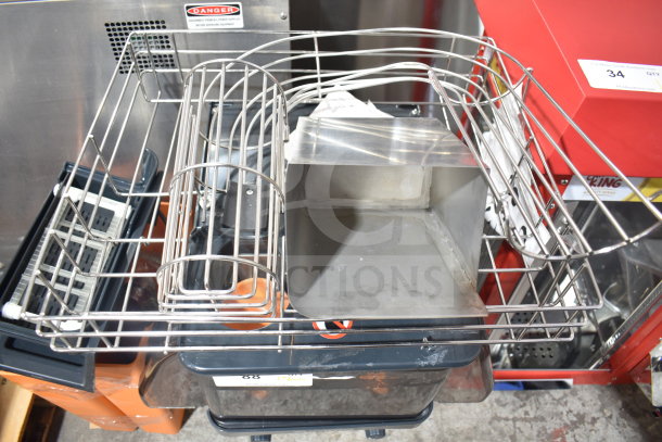 Zummo Z06C-N countertop orange juicer in stainless steel, featuring a wire basket. Displays a "Danger" warning label.