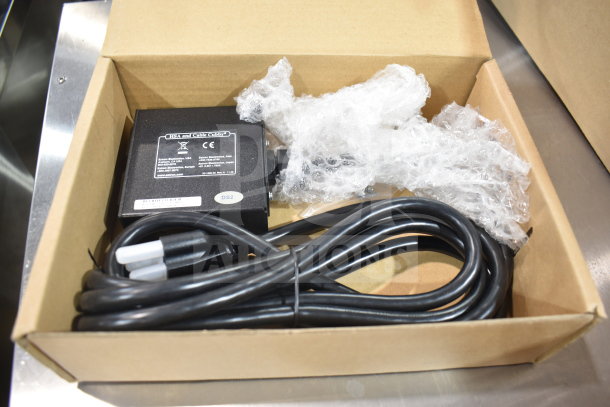 Extron 70-261-01 Cable Cubby AC Power Module in box; includes cable and bubble wrap. Condition new with label and model marking.
