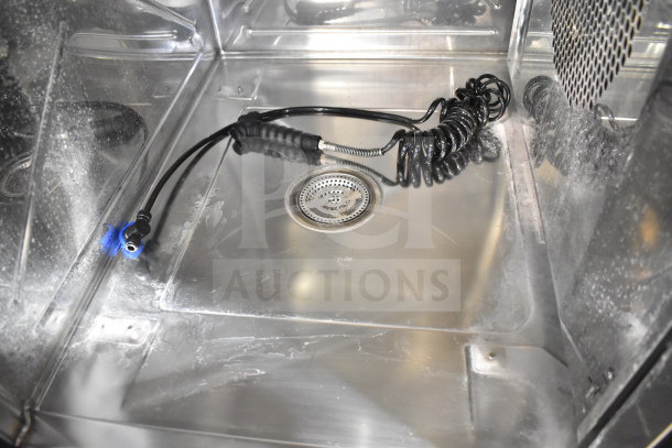 Interior of a 2023 Blodgett Invoq Hybrid combi convection oven, showing a pristine stainless steel chamber with coiled hose, highlighting new condition despite scratch and dent status.