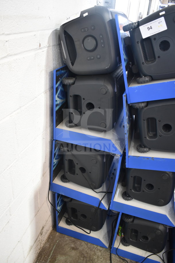 "4 Onn large party speakers in display boxes, each with control panel and wheels, good condition, auction lot with quantity tags."