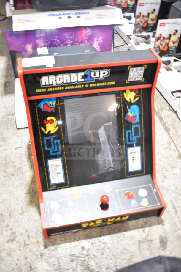 Arcade 1UP Pac Man Machine PAC-A-501030, featuring vibrant graphics, joystick controls, and classic arcade design in good condition.