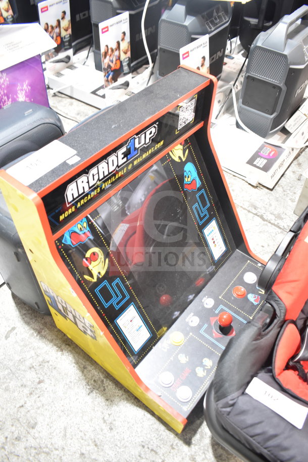 Arcade 1UP PAC-A-501030 Pac Man machine, classic design, joystick controls, good condition, branded side graphics visible.