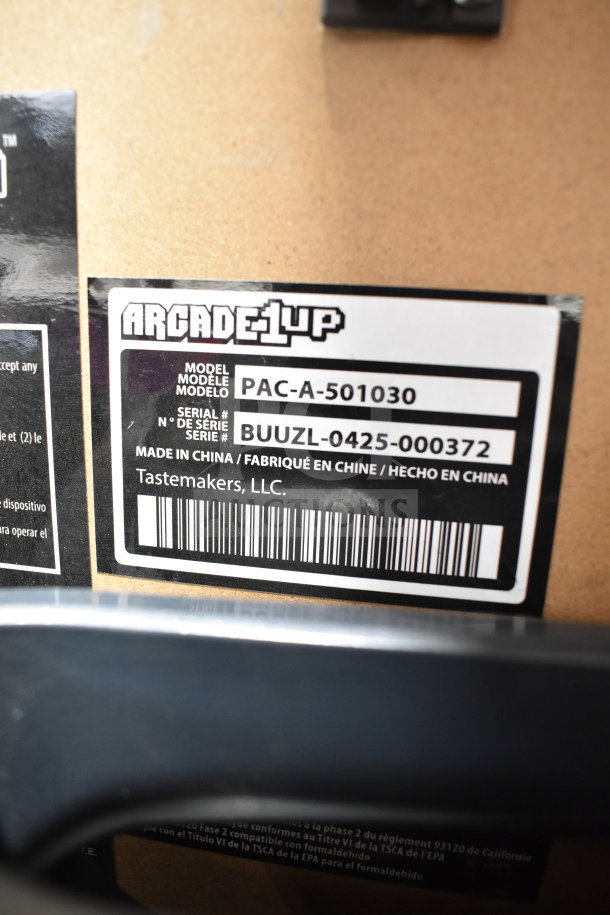 Arcade 1UP PAC-A-501030 Pac Man Machine label showing model and serial number. Made by Tastemakers, LLC.