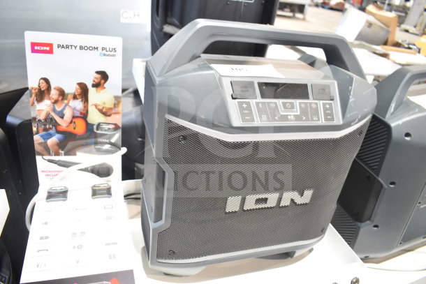 Ion Party Boom Plus Speaker on display, Bluetooth-enabled, microphone included, new condition, promotional signage visible.
