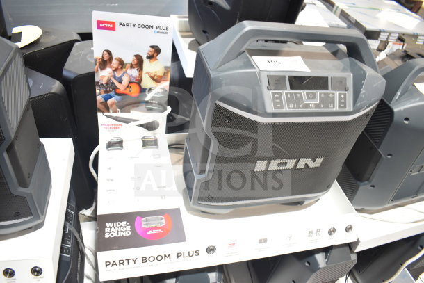 Ion Party Boom Plus speaker on display. Features Bluetooth connectivity, control panel, and wide-range sound. Includes microphone.
