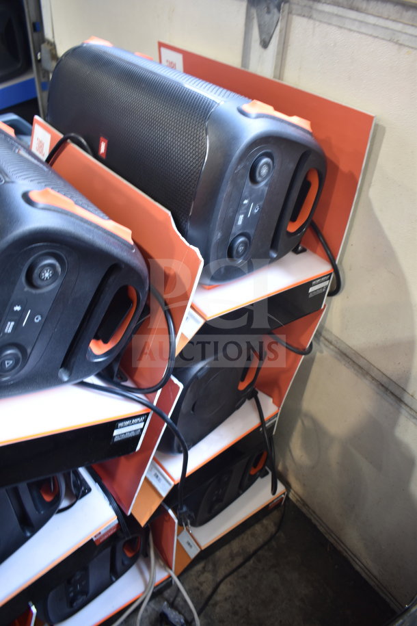 4 JBL Partybox 110 speakers stacked in display boxes. New condition, auction offers four times your bid value.