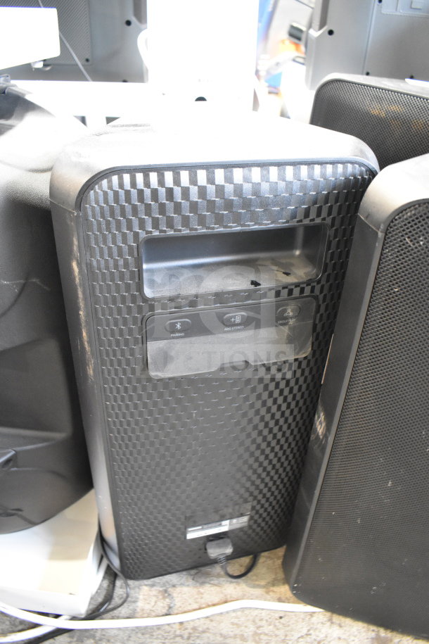 Samsung MX-ST4CB speaker with black checkered pattern, visible controls, and slight wear. Auction for three units.