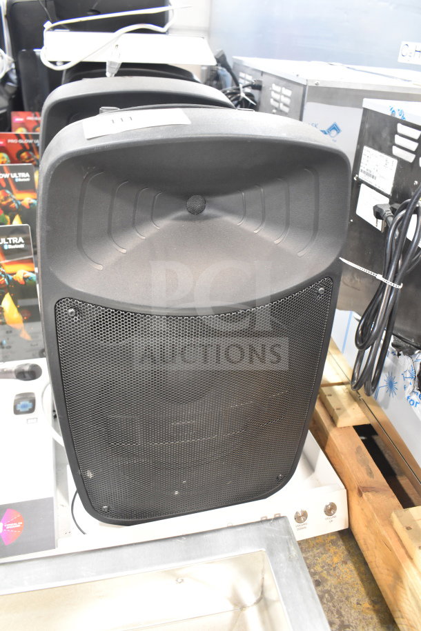 Pro Glow Ultra Speaker store display, black, mesh grille, and product packaging visible. Appears in good condition.