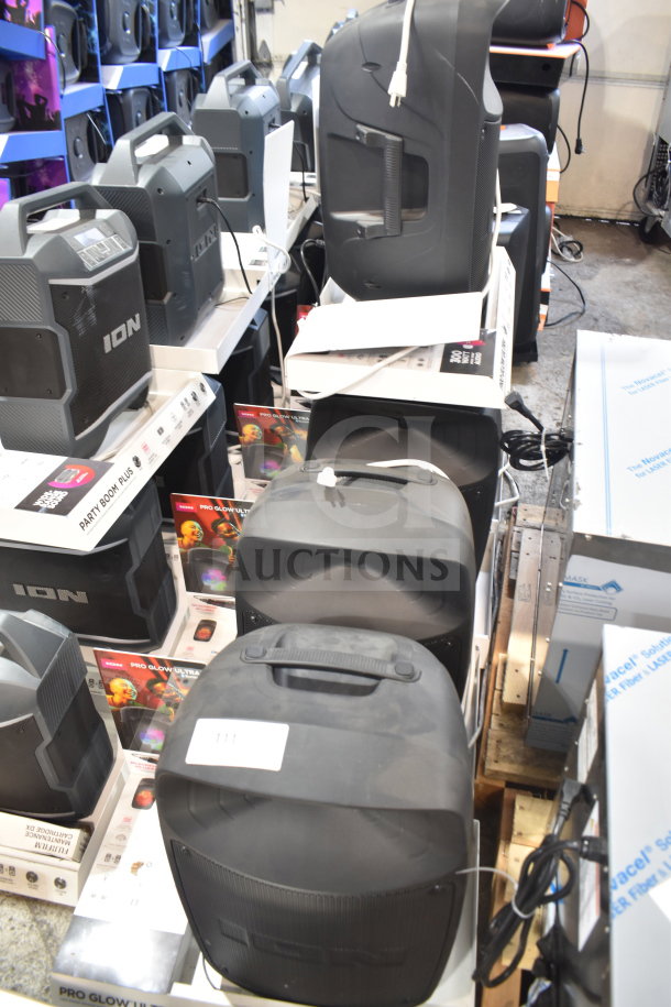 Store display featuring multiple ION speakers including Pro Glow Ultra. Good condition, visible packaging and model details.