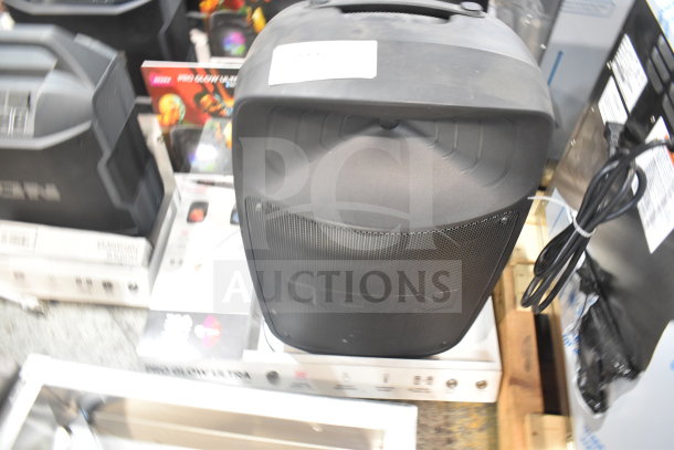 Pro Glow Ultra Speaker store display, featuring a sleek black design, front grille, and control buttons visible. Includes packaging.