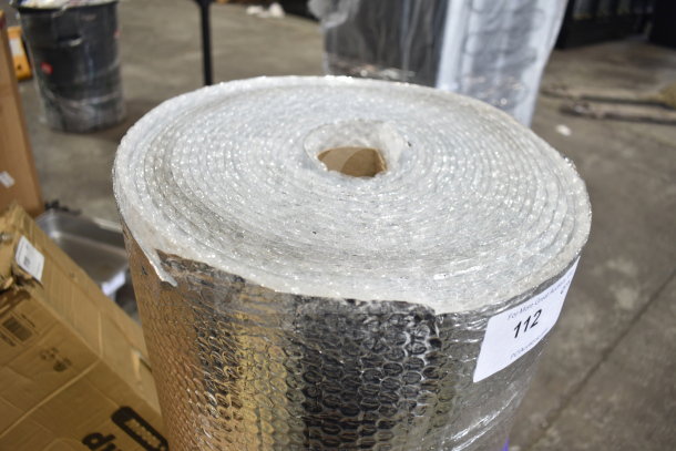 Roll of bubble wrap packaging with reflective surface, in excellent condition. Auction tag indicates item number 112.