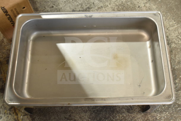 "Brand new chafing dish frame with drop-in; minor scratches and dents. Stainless steel construction, ideal for catering."