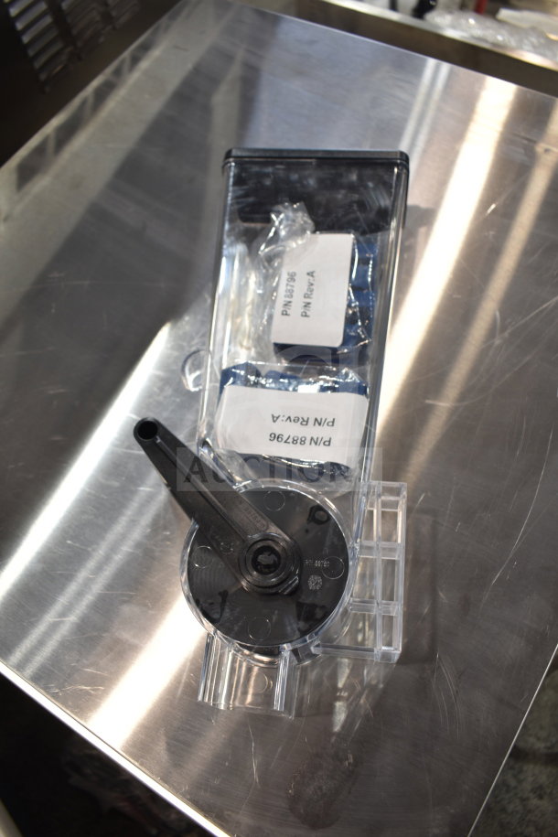 Brand new scratch and dent dry goods dispenser, with labeled parts P/N 88796. Includes extra items. Clear and black design.