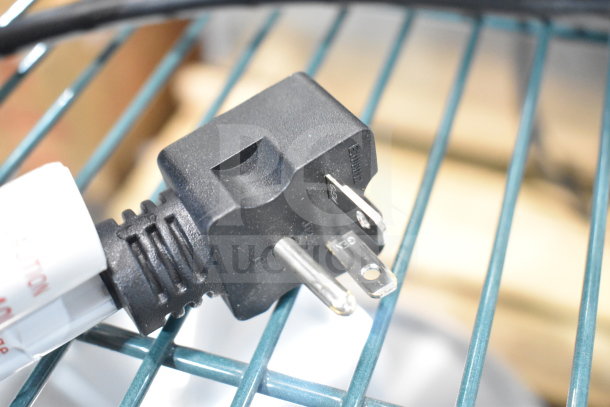 Alt text: Plug of Avantco 184THD27240 commercial toaster, new condition, on a metal rack.