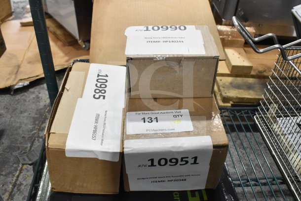 Three boxes of brand new items including Henny Penny 140244 Drain Valve, 86157 Actuator Motor, Blodgett 20348 Spark Box Assembly.