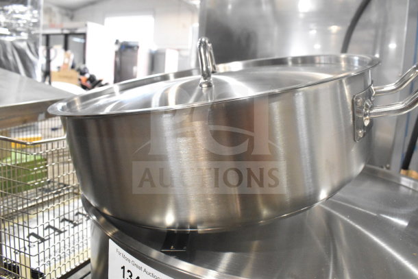 Stainless steel stock pot with lid and handle, part of a set including Henny Penny 50703 basket, new condition.