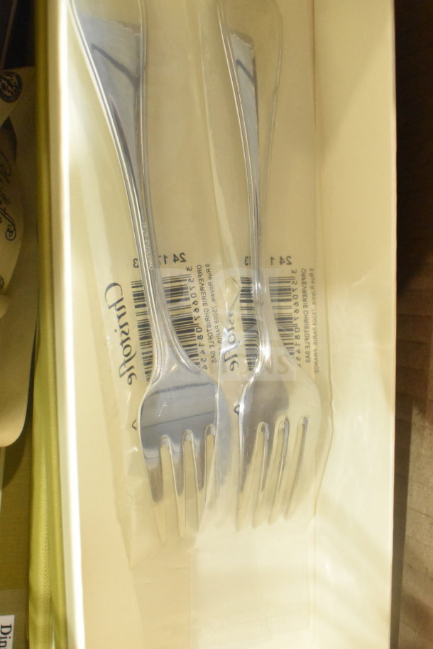Brand new scratch and dent forks, sealed in packaging, showing barcodes and markings.