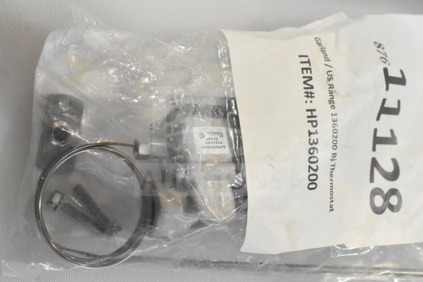 New Garland/US Range Bj Thermostat 1360200 in original packaging labeled "HP1360200," includes installation materials.