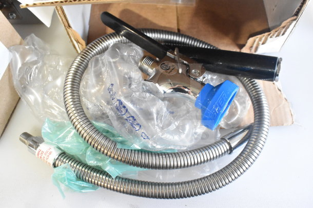 2 Brand New Scratch and Dent Items: Henny Penny Selector Valve Motor and Fisher 36" Hose Assembly with Spray Valve.