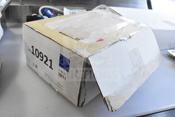 Box containing Henny Penny 84282-001 Selector Valve Motor and Fisher 2911 36" Hose with Spray Valve, showing lot number 10921.