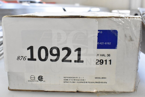 Box showing label for Fisher 2911 36" Hose Assembly, 1.15 GPM spray, and auction lot number 10921. New condition.