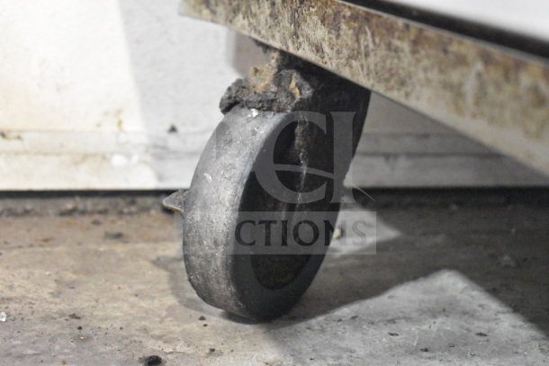 Delfield commercial chef base caster, showing wear and rust, part of a 4 drawer unit, 115 volts, 1 phase.