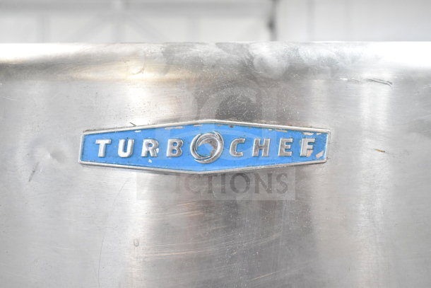 Turbochef HhC2020 logo on stainless steel rapid cook oven. Blue emblem, slight wear. Ideal for commercial use.