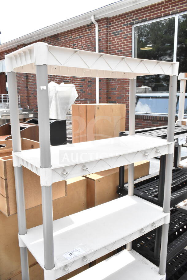 Tan Poly 5 Tier Shelving Unit, made of durable plastic, in good condition. Features include stable legs and spacious shelves.