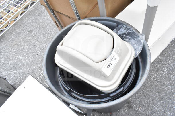 Two trash cans stacked; one is a gray open-top, the other is a beige swing-top lid with a visible label reading "163."